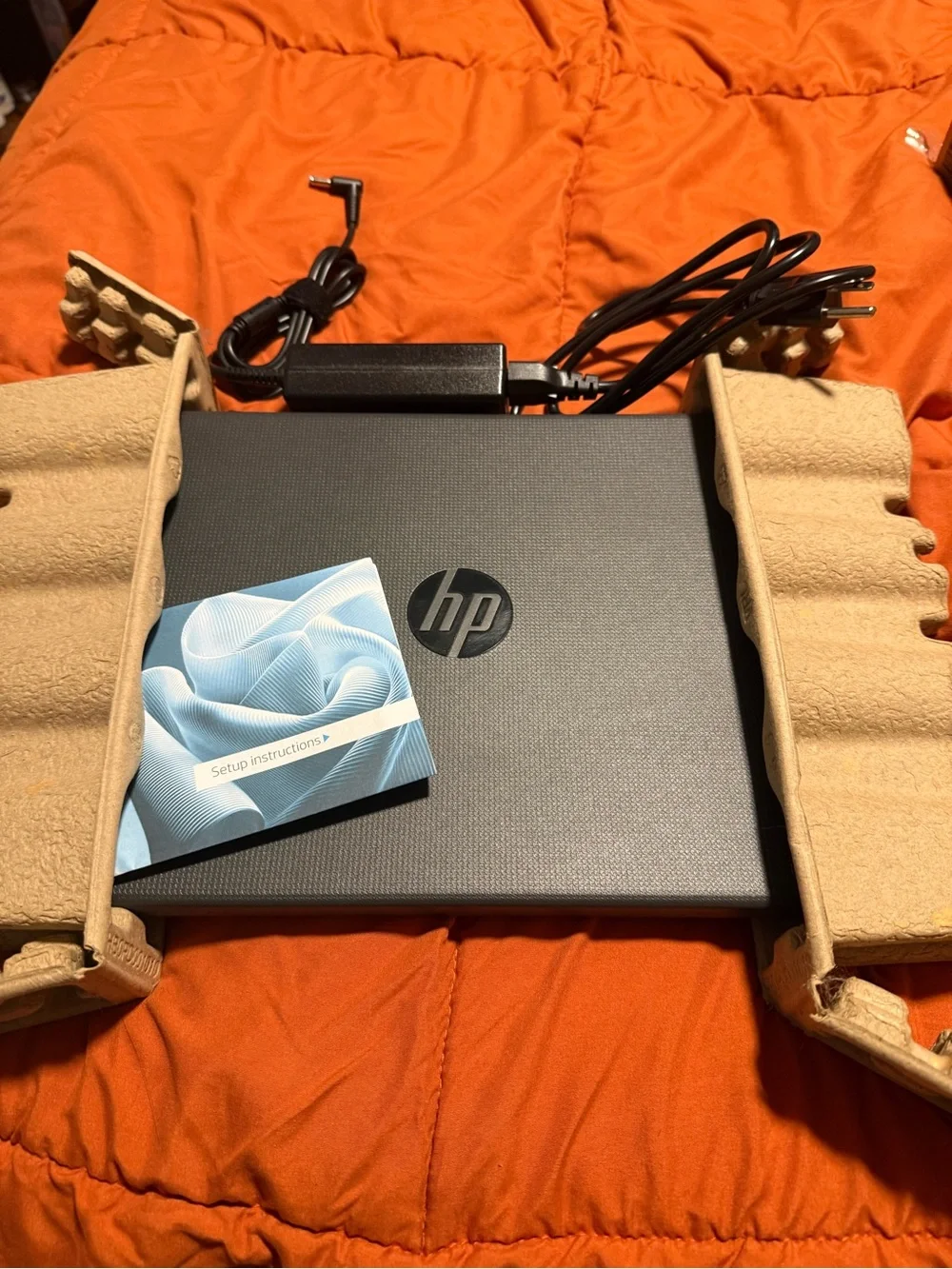 HP Laptop in Dark Gray with Charger and Setup Guide